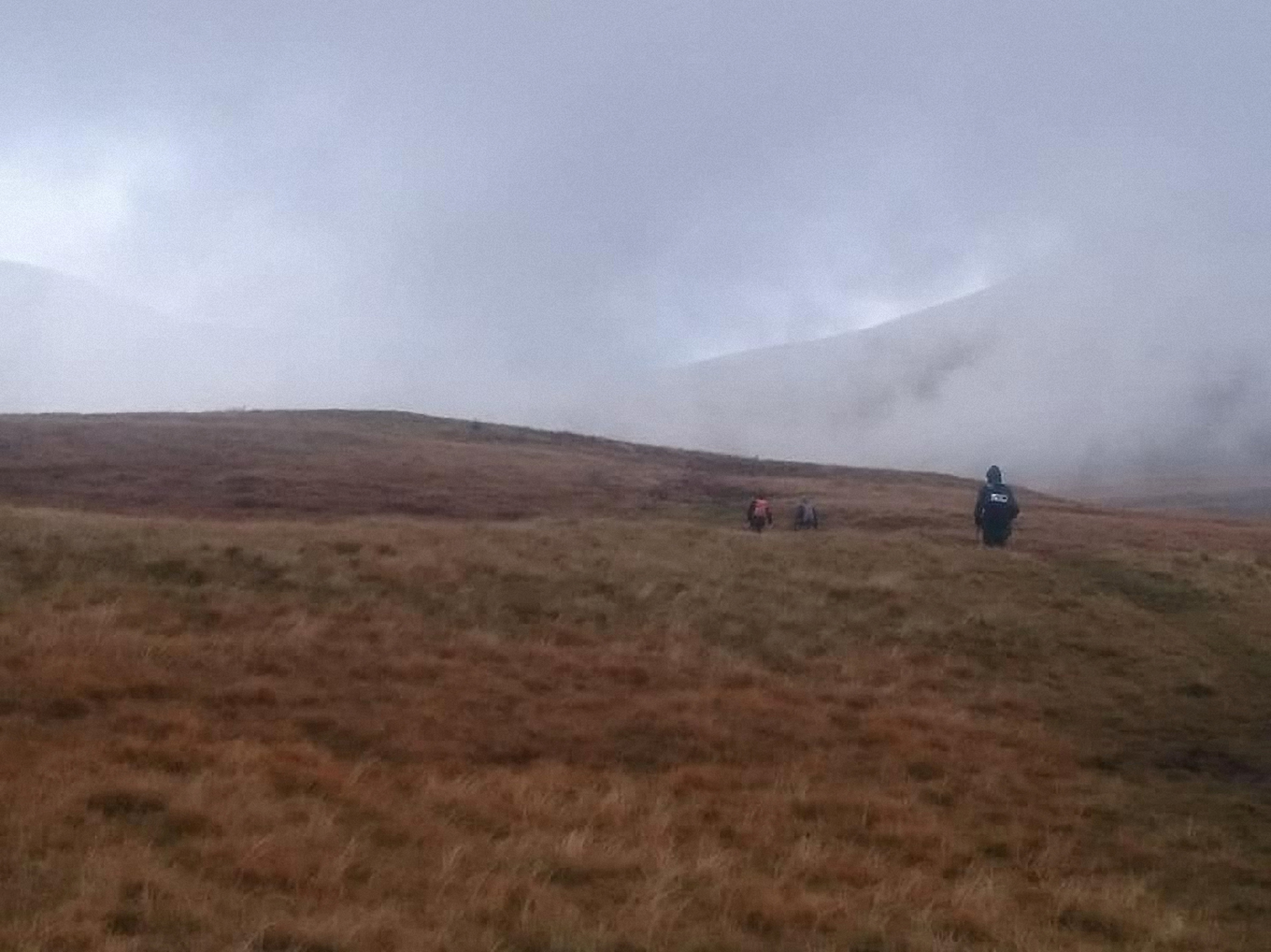 The rain has stopped, walking in the mist up the flank of Fan Fawr, Photo by Andy Burton